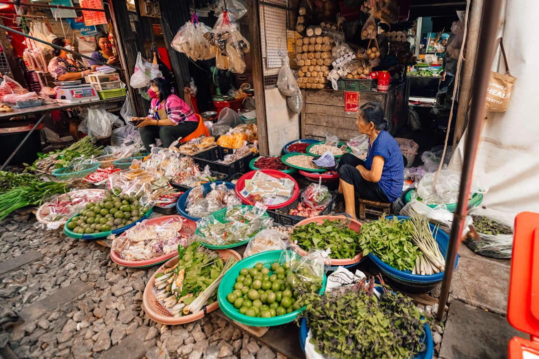 Fresh produce is sold at a bustling market.