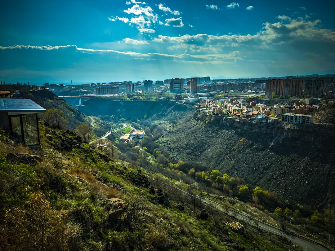 a scenic view of a city from a hill